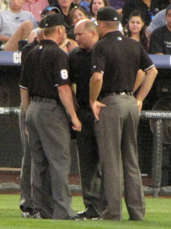 Umpires discussing 6-19-10.jpg